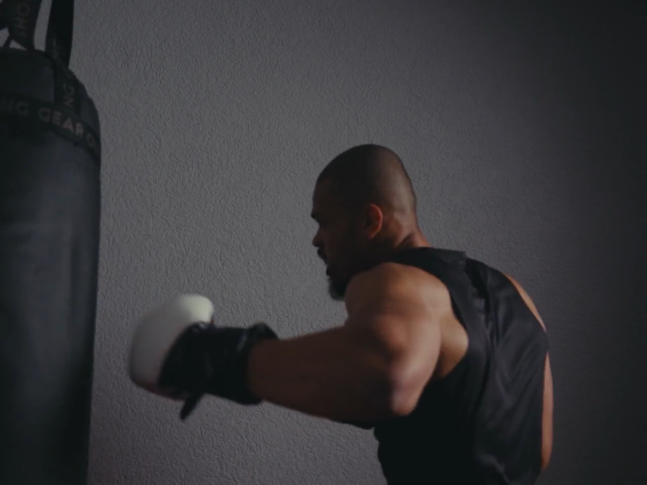 A boxer training at a heavy bag