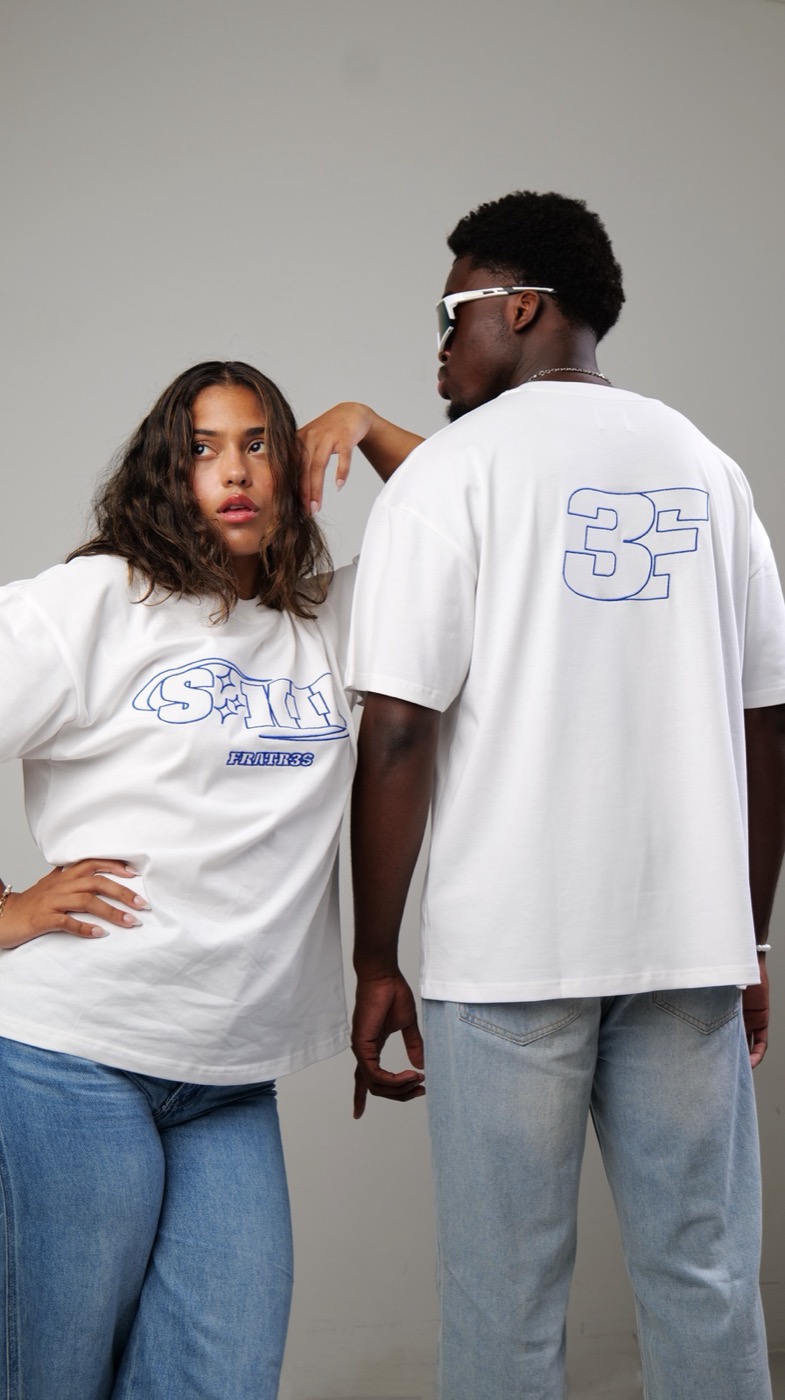Two models posing in Fratr3s t-shirts