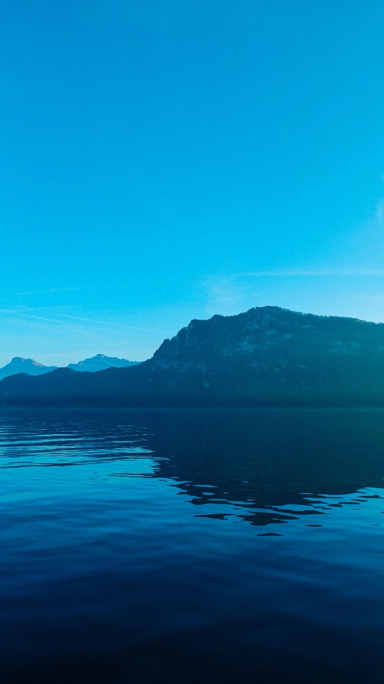 Mountain reflected in a still blue lake